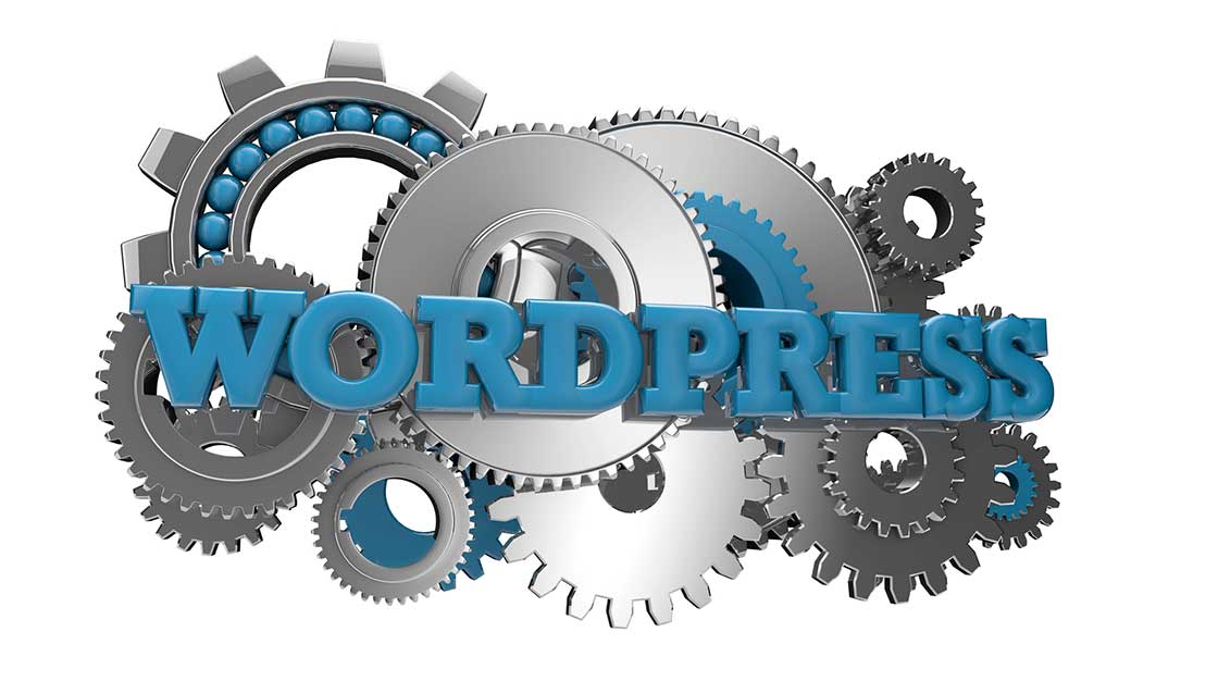 WordPress-word-and-gears-in-the-background-to-represent-the-role-of-CRM-on-website-redesign